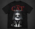 Black t-shirt with a graphic of a cat wearing bunny ears and the text 'THE CAT' on a dark background.