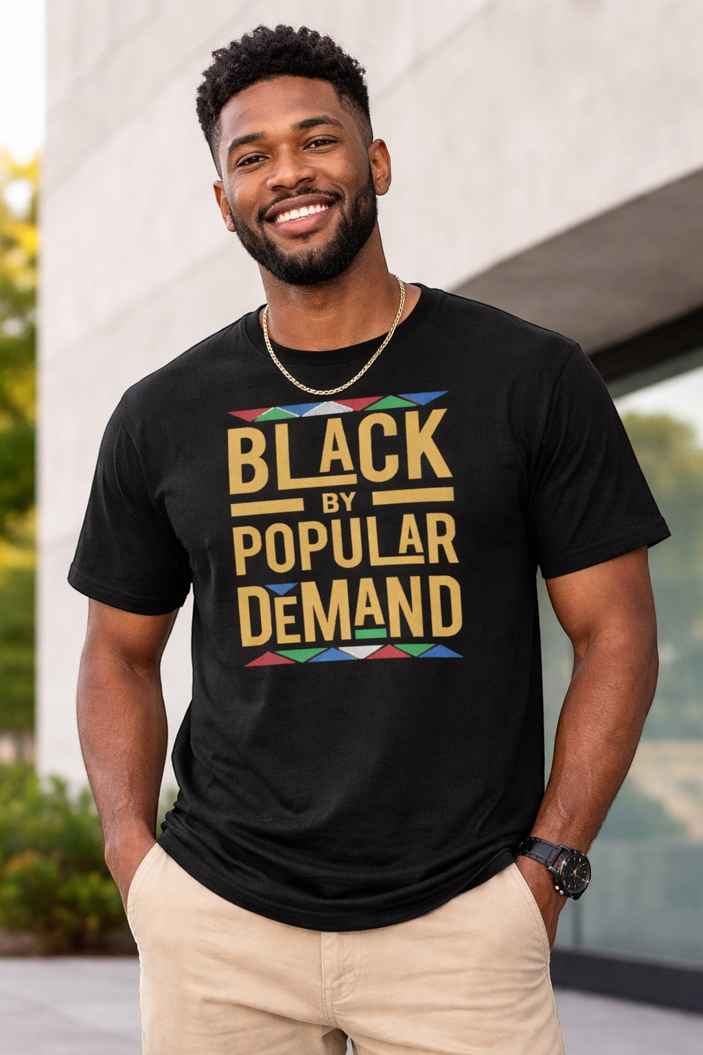 Black Flag Promotions black crewneck t-shirt with gold Black By Popular Demand text and colorful geometric accents