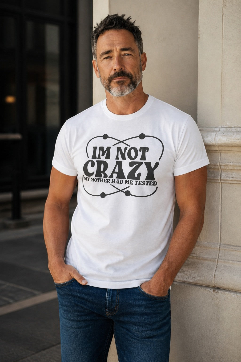 Black Flag Promotions white cotton t-shirt with I'm Not Crazy My Mother Had Me Tested science graphic on a man
