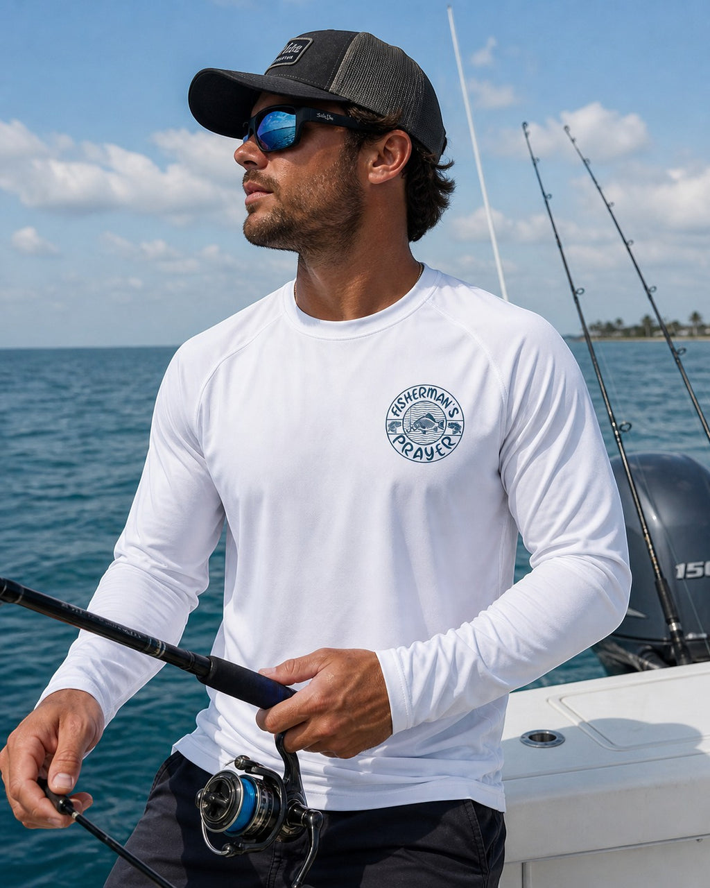 Black Flag Promotions white long sleeve performance fishing shirt with Fisherman's Prayer graphic worn by a man on a boat