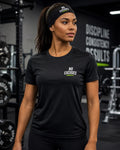 Woman wearing a black 'No Excuses' t-shirt in a gym setting