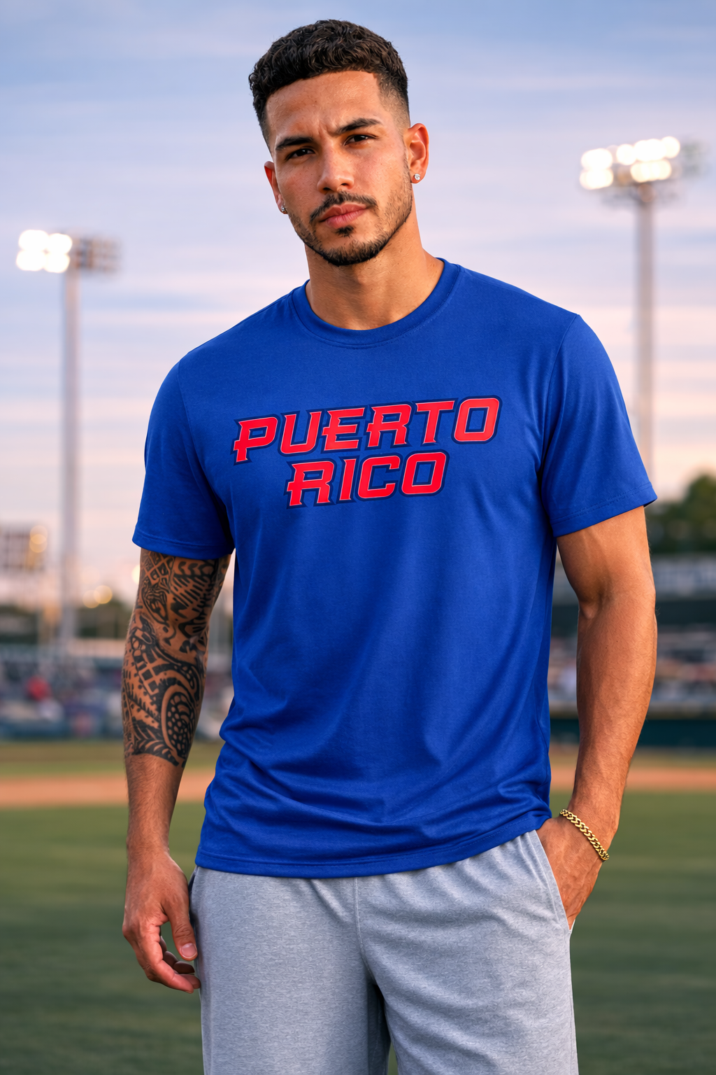 Man wearing a blue t-shirt with 'PUERTO RICO' printed in red on a sports field.